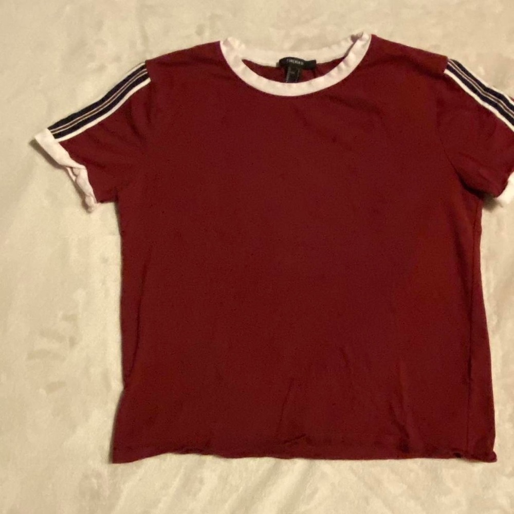 maroon shirt with striped sleeves